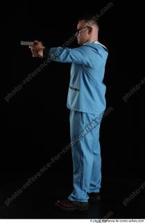 03 2018 01 MICHAL AGENT STANDING POSE WITH GUN
